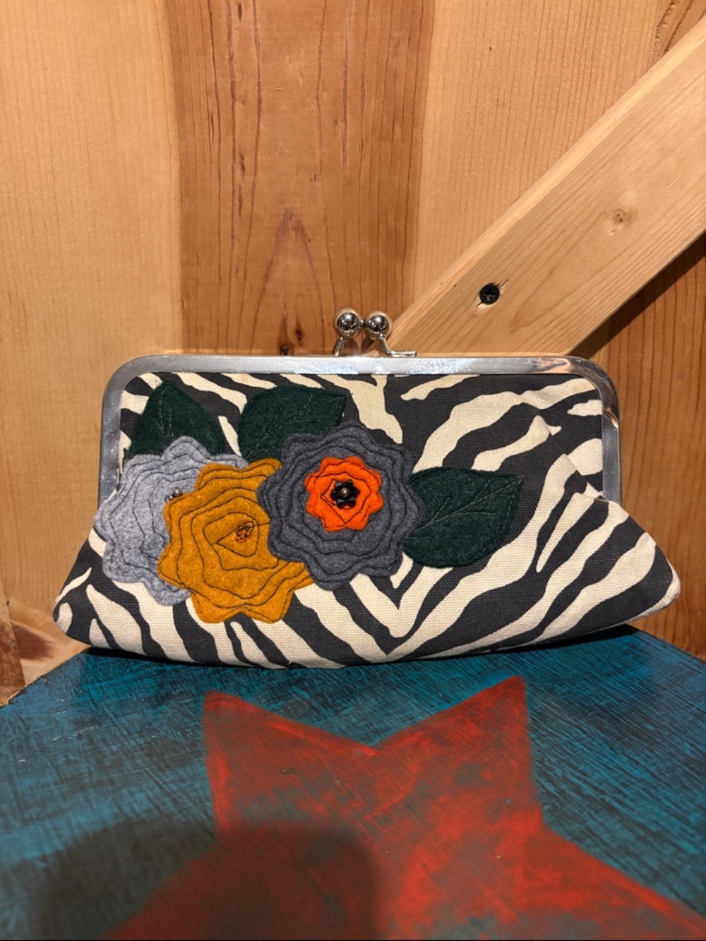 R.A.C artisan accessories Zebra Print Floral Applique Clutch -